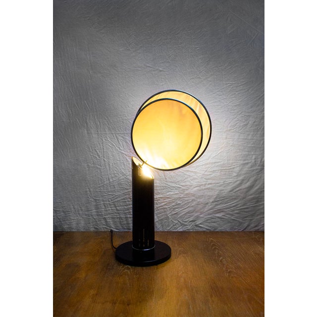 Swivel table lamp with lacquered metal frame and adjustable fabric lampshades. Biblos model Designed by Augusto Mandelli...