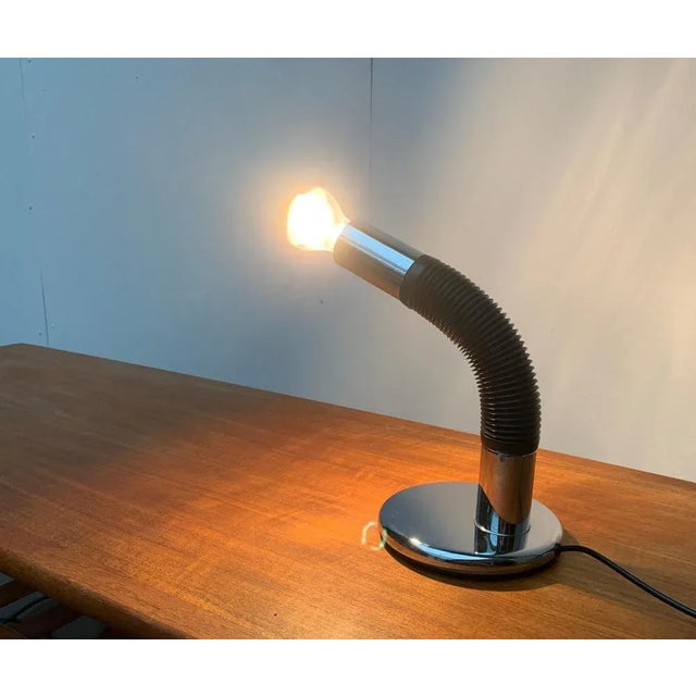 Targetti Sankey Space Age table lamps in chrome. The luminaire head is movable via the flexible central part of the light....