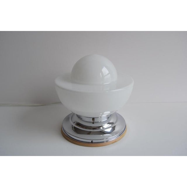 Designer ceiling light from 30 years, made in Czechoslovakia. This beautiful piece is made of Wood, Chrome and Glass The...