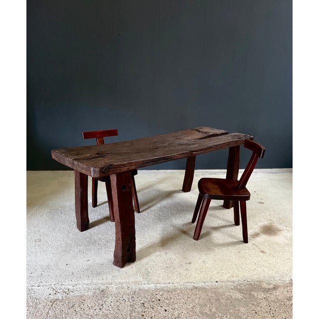 Early 19th Century Handcrafted Brut Made Carved Workbench Table. Dark stained oak brut carved and set together with heavy...