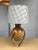 Design Plus Gallery presents an Amber Glass Table Lamp. The large lamp is a nice bulbous bodied shape with a narrow neck....