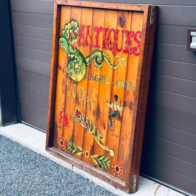 American Original Antiques Store Hand Painted Wooden Double Sided Sign With Dragon & Unicycle C. 1974 For Sale - Image 3 of 12