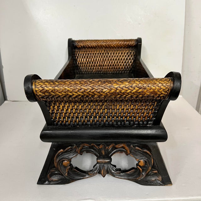 Vintage sleigh style rattan and wood cachepot on heavily carved base. Measures 19” w x 10.5” d x 10” h. Suits many style...