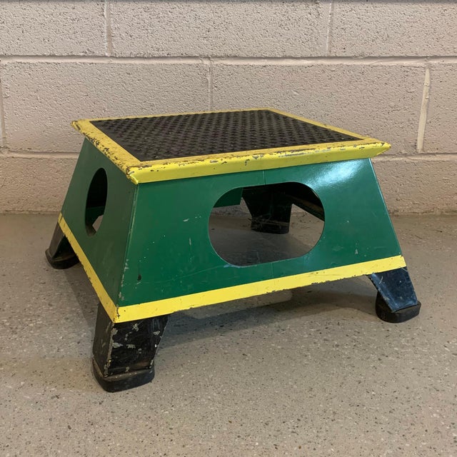 Industrial, painted steel, train conductor's step stool that tapers at the top to 15.5 x 13.5 inches features it's all...