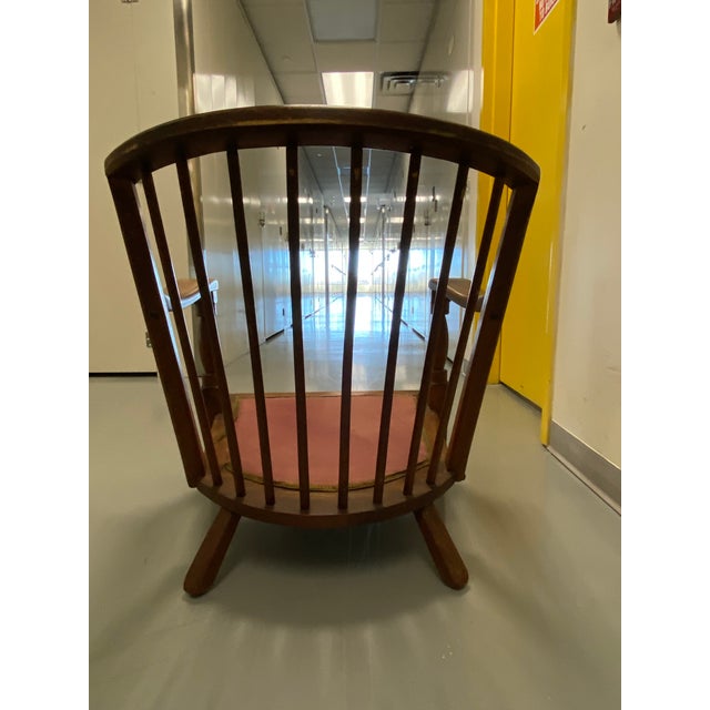 This sturdy chair is made of solid rock maple and has a medium reddish brown stain. Although the chair does not have any...