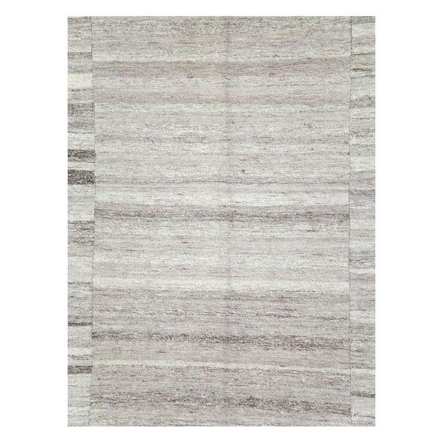 A vintage Turkish flat-weave Kilim accent rug handmade during the mid-20th century made up of 3 columns with several...