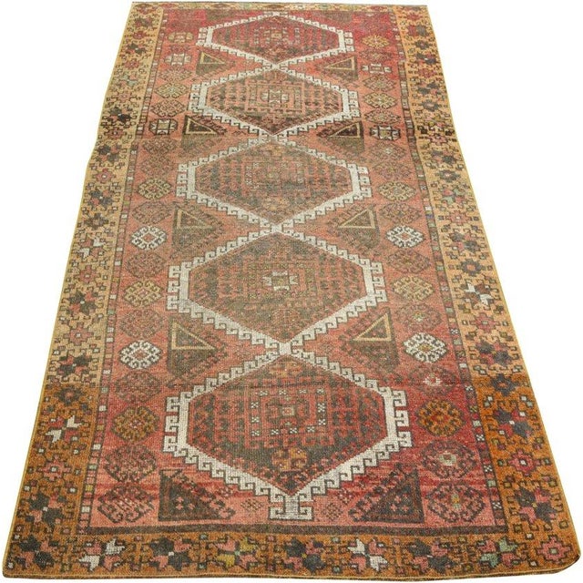 Hand-knotted with care using traditional rug-making techniques, this wool rug blends timeless craftsmanship with a modern...