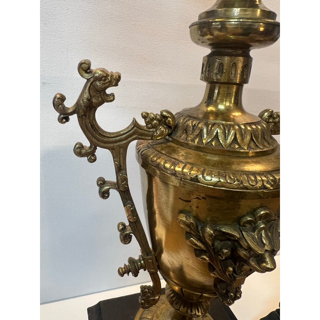 Beautiful pair of unique ormulo brass candleabras. Marble bases have a few chips, please see pictures. One bobeche is...