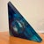 A captivating work of contemporary sculpture by D. Young, signed and dated 1998. Crafted from richly pigmented blue Lucite...