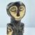 A hand-carved Lega figure originates from the Lega people in the Democratic Republic of the Congo. The figure is easily...