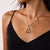 This beautiful Victorian lyre necklace is a romantic antique design from the 1900’s, featuring 15 old mine and rose cut...