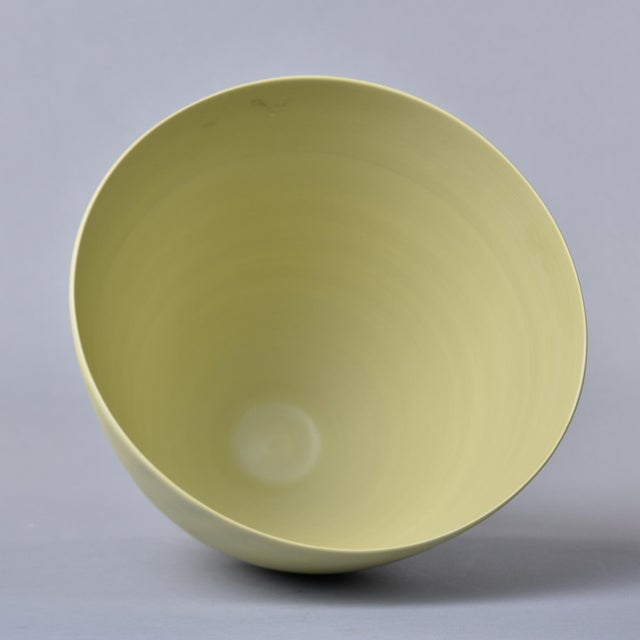 New and hand made in Italy by Rina Menardi, this cup-form bowl or vase stands just under 11” tall and has a pale pistachio...