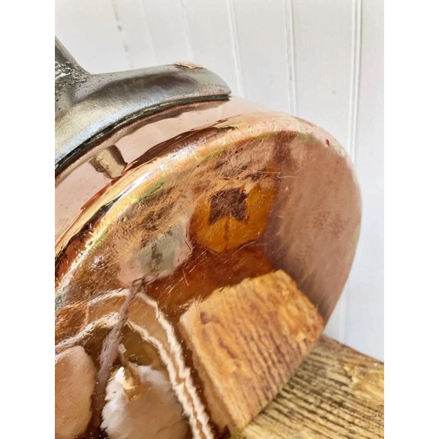 A beautiful antique circa 1929 copper pot with iron handle and hand-applied tin lining, from the Cafe Bonaparte in the...