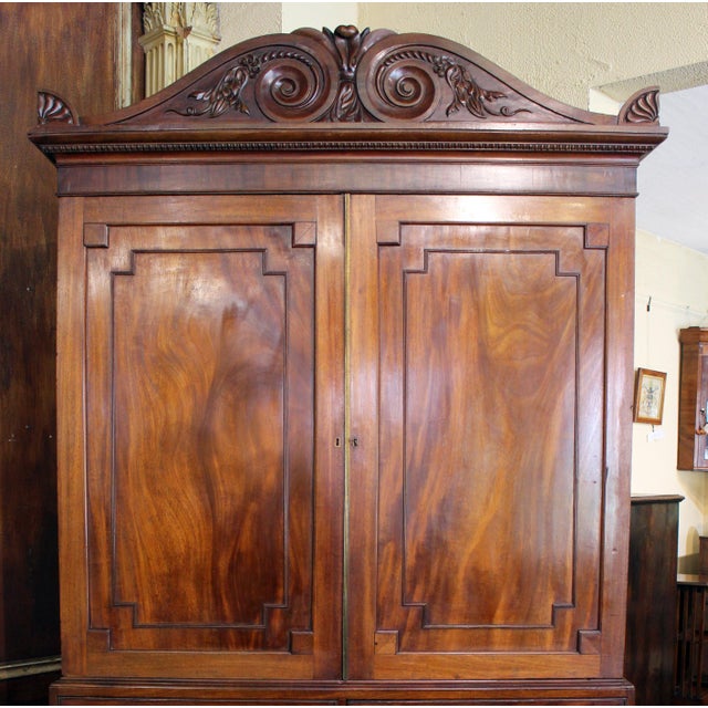 Regency period circa 1815 Linen Press, English. Impressive form & proportions. Displaying panelled doors & French splay...