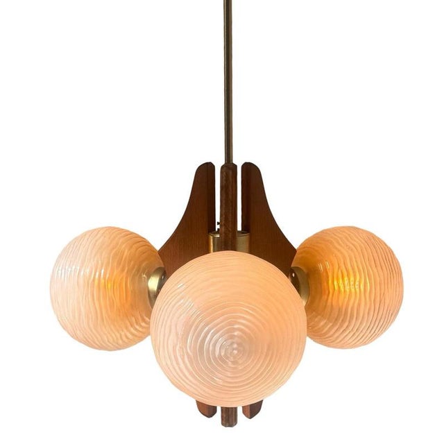 Mid century modern / Ca 1960’s Space age design Chandelier or pendant lamp. Made from solid wood, brass upright and mounts...