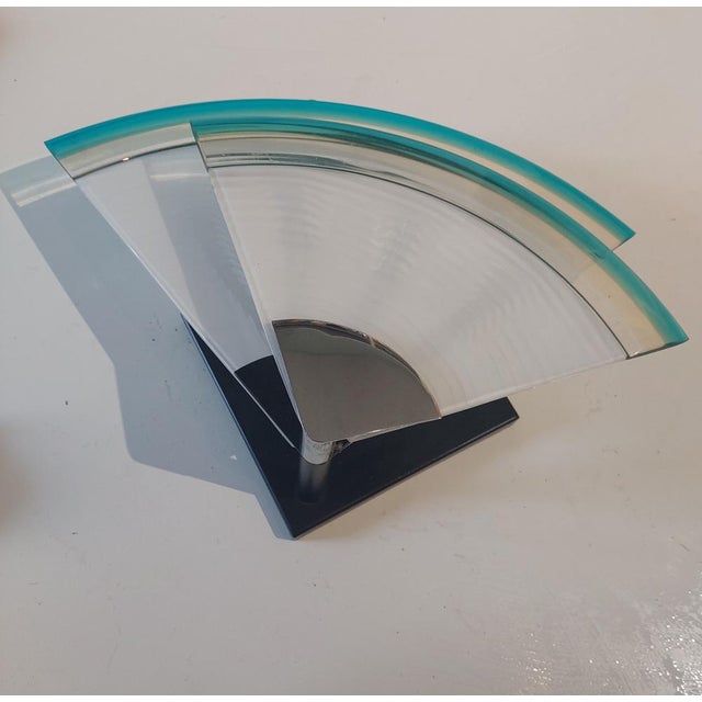 This striking wall light is attributed to a renown architect designer, Renato Toso for Leucos Italy around the 1970's.It...