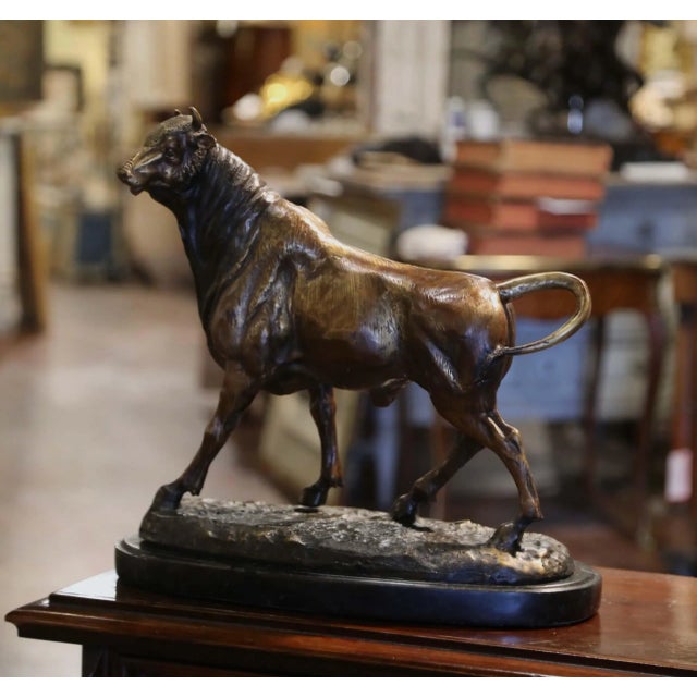 Add a touch of strength and character to an office, library, or study with this impressive antique French bronze bull...
