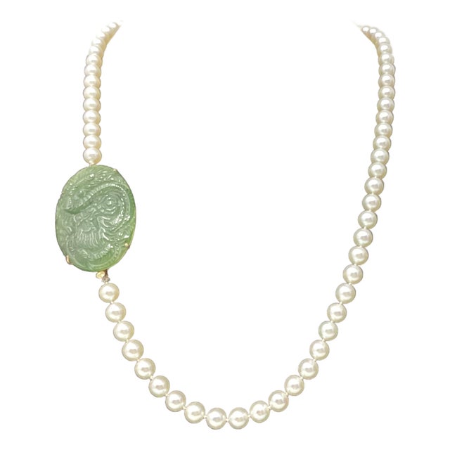 Late 20th Century 18k Yellow Gold Framed Jadeite Pendant With Dragon Motif Attached at the Sides to 23.5" White Pearls For Sale