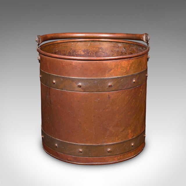 This is an antique waste paper basket. An English, copper study or home office bin, dating to the Edwardian, circa 1910. A...