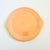 A large vintage Fiestaware cake serving plate in an apricot glaze. Features a lovely circular embossed pattern and handles...