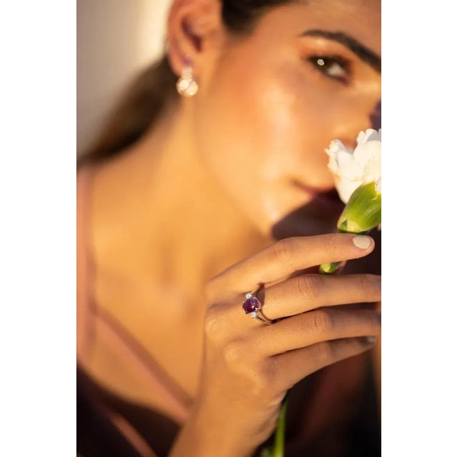 This is part of Chairish’s Fine Jewelry assortment. Pink sapphire and diamond three stone ring in 18K gold which perfectly...