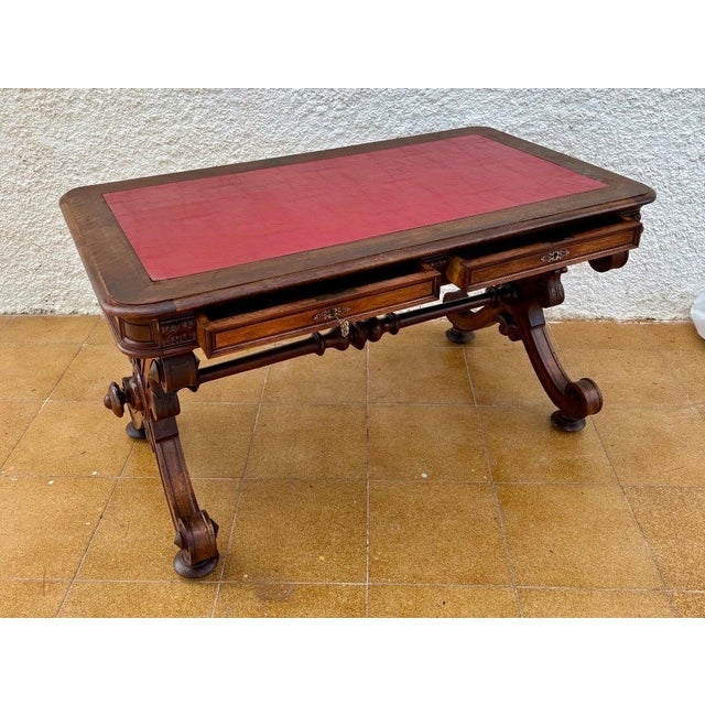 Magnificent Spanish Baroque Revival writing table dating from the 20th century, featuring an elegant leather-inset top...