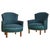 A French Art Deco armchair from the 1940s, defined by its curved backrest and enveloping arms that taper gently toward the...
