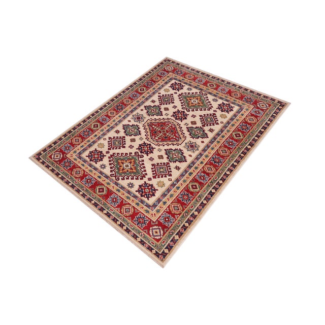 Enhance your home with this exquisite hand-knotted Kazak rug, crafted from fine hand-spun wool and dyed with all-natural...