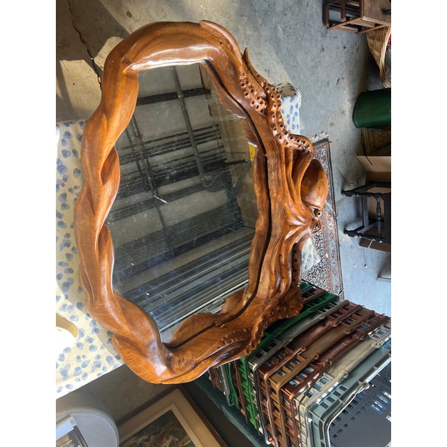 Elevate your space with this gorgeous hand, carved wooden octopus mirror. Perfect for a beach house or ocean front...