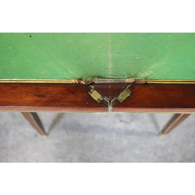 This elegant French Louis XVI–style mahogany games or napkin table exemplifies the refined neoclassical aesthetic that...