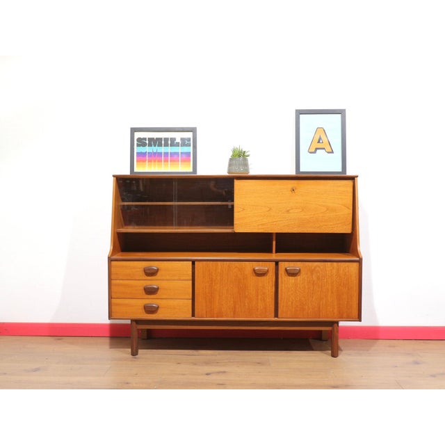 This beautiful tall credenza exemplifies Danish style at its finest, offering fantastic storage while maintaining a...