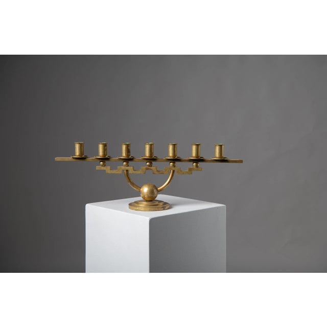 Scandinavian modern candlestick holder by Lars Holmström, Arvika Sweden. The candlestick holder has seven arms and boasts...