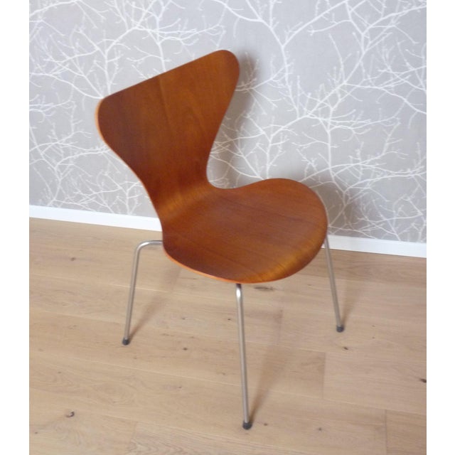 Chair designed by Arne Jacobsen in 1955, Mod. 3107, teak finish with chrome base. The item is in perfect condition, with a...