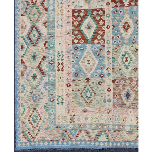 Keivan Woven Arts, Orn-30108, Diamond Design Afghan Kilim Rug - 8′5″ × 11′6″. This embroidered flat-weave Kilim bears a...