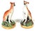 Pair of Victorian Staffordshire Pottery Seated Whippet Figures, Circa 1860 His charming pair of Victorian Staffordshire...