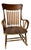 A charming Antique Windsor-style rocking chair featuring a classic comb back design with turned spindle supports and...