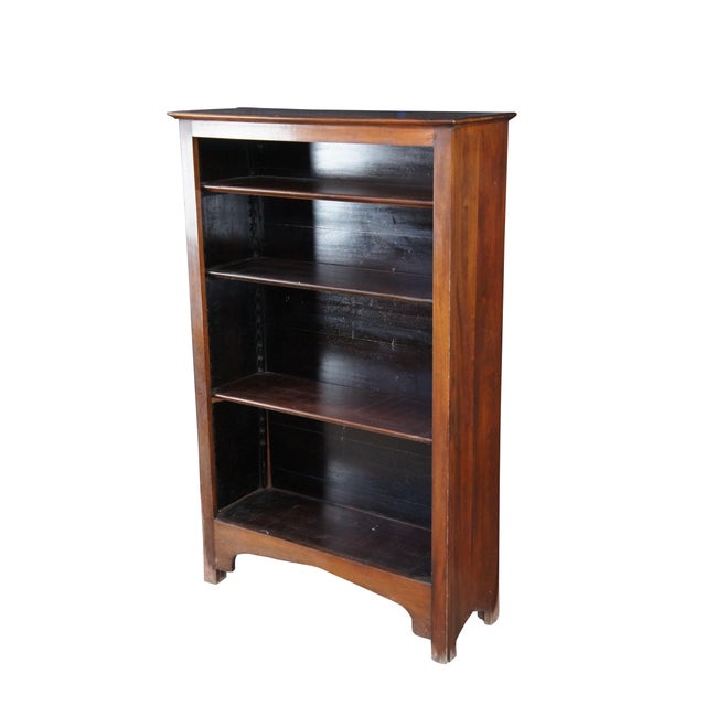 Antique mahogany bookshelf or bookcase featuring rectangular form with four adjustable shelves. Dimensions: 33.5" x 12" x...