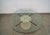 Vintage 1970's Mid century Modern Italian coffee table for sale. It's made of Italian travertine with brass brackets, and...