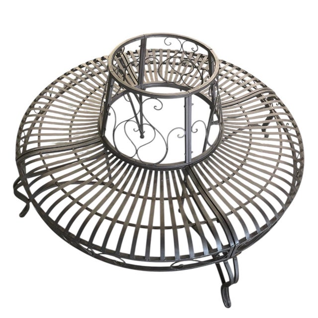 Give old-world charm to your landscape with this elegant circular tree bench. Crafted from durable wrought iron with a...