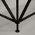 A wrought iron console table with a blue stone top. The structure features a simple industrial form with an emphasis on...