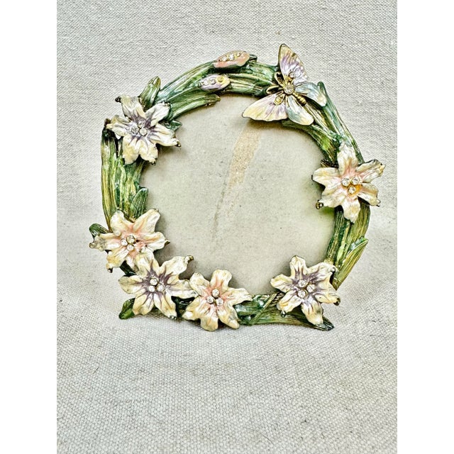 Beautiful vintage style picture frame. Enamel butterfly, flower and grass design. Perfect for spring. Picture opening 3.5”...