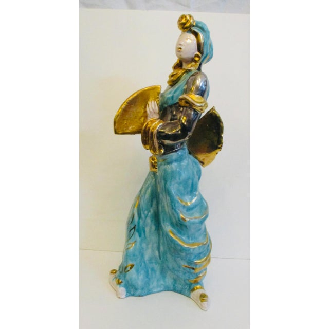 Large and beautiful turquoise glaze and bright gold luster glazed Harem Girl. Made in the 1950s in Italy. Terra cotta...