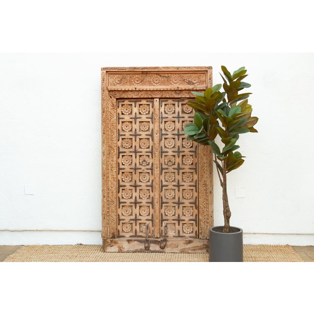 These mesmerizing antique doors, hand-carved from solid teak, offer a glimpse into the rich architectural heritage of...