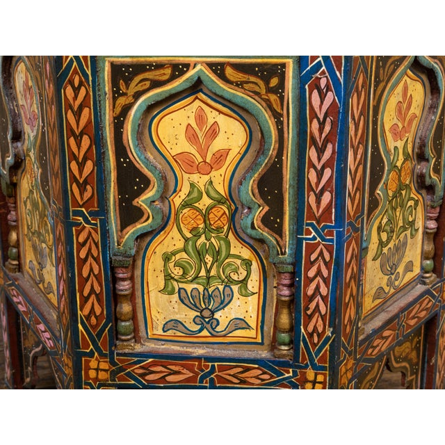 A Moroccan Moorish style drinks table from the early 20th century, with painted geometric motifs, hexagonal top,...