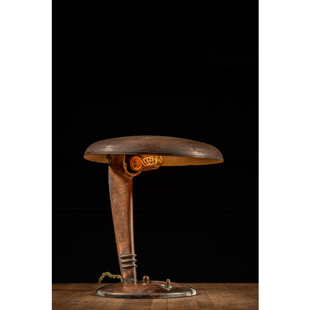 Vintage brass “Cobra” desk lamp manufactured by the Faries Manufacturing Co. of Decatur, Illinois, during the 1940s....