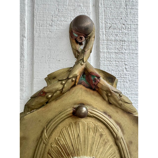 Early 20th Century Antique Ornate Bronze French Empire Style Garland Sconce With Versace Style Sunface Detail For Sale - Image 5 of 7