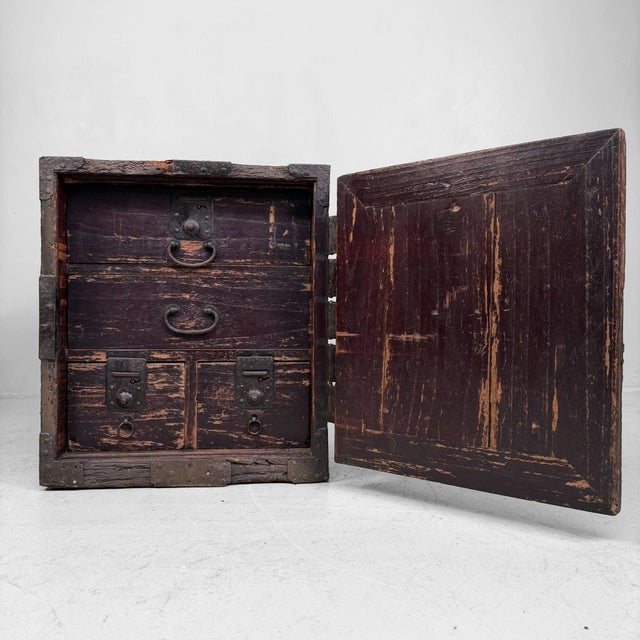 This antique Japanese portable piece was made as a sturdy valuables chest, also known as a hako tansu: a lockable “mini...