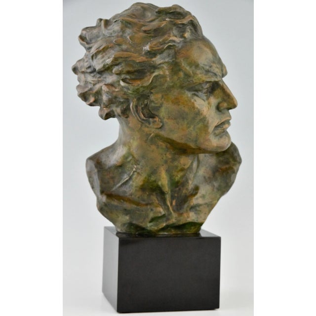 Art Deco bronze sculpture male bust by Ugo Cipriani. Patinated bronze. Belgian black marble base. France 1930. This piece...