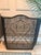 Add timeless elegance to your hearth with this substantial three-panel wrought iron fireplace screen featuring graceful...