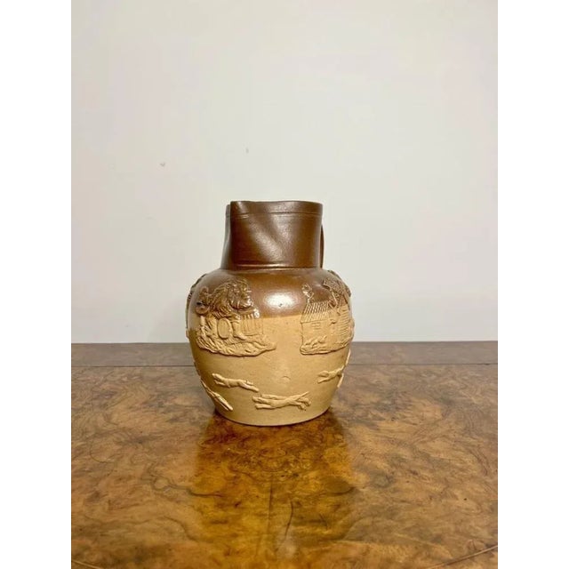 Large antique Victorian Doulton Lambeth harvest jug having an antique Doulton lambeth harvest jug decorated with hunting...